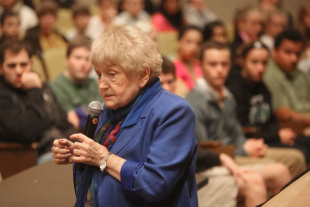 Holocaust survivor Eva Mozes Kor speaks to 8th graders at Valparaiso High School's auditorium.